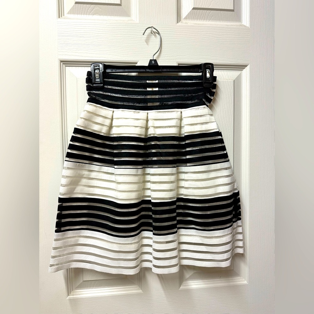Woman’s black and white striped skirt. Size medium.